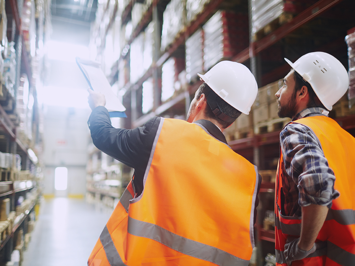 Two warehouse employees utilizing a well-built distribution network