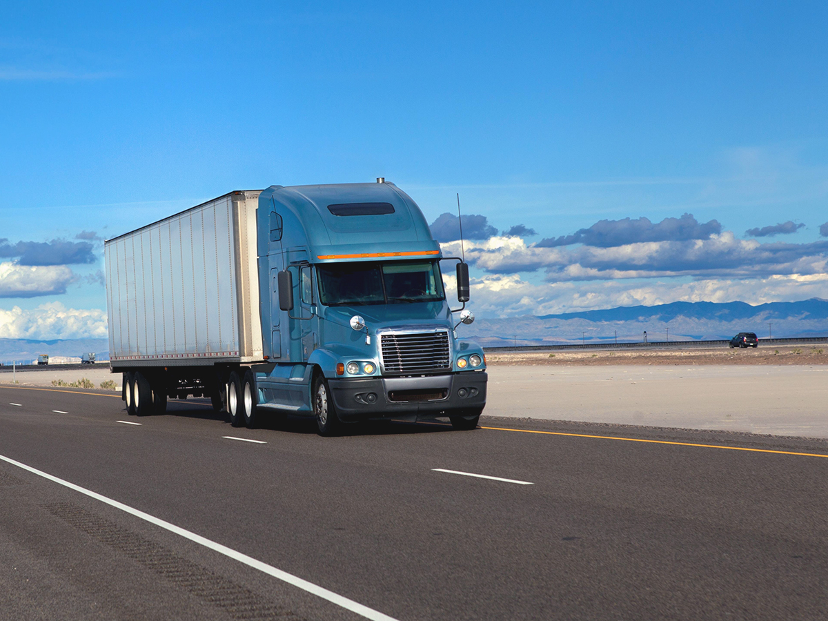 A delivery truck on the road, delivering parcels faster thanks to effective route optimization